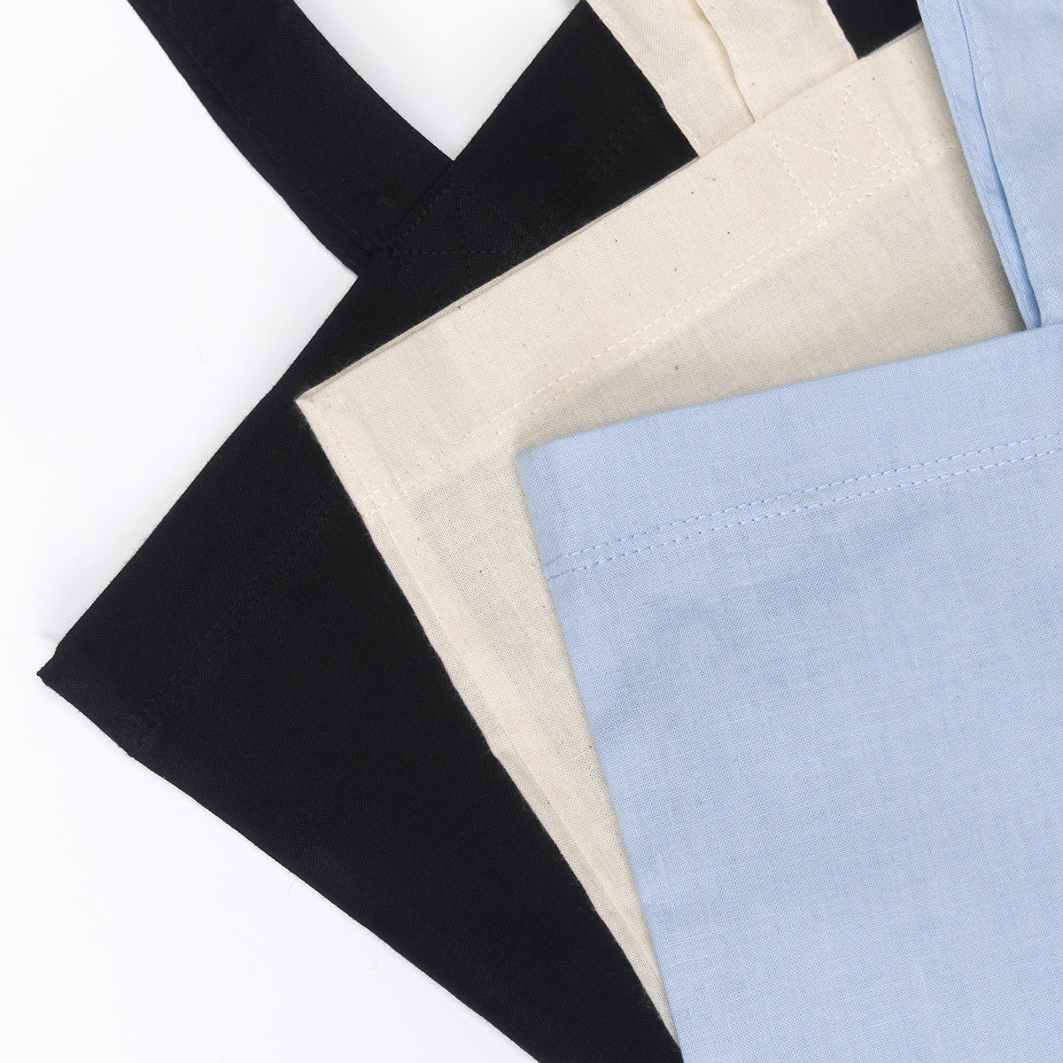 Tote bags i sort, natur og lyseblå
